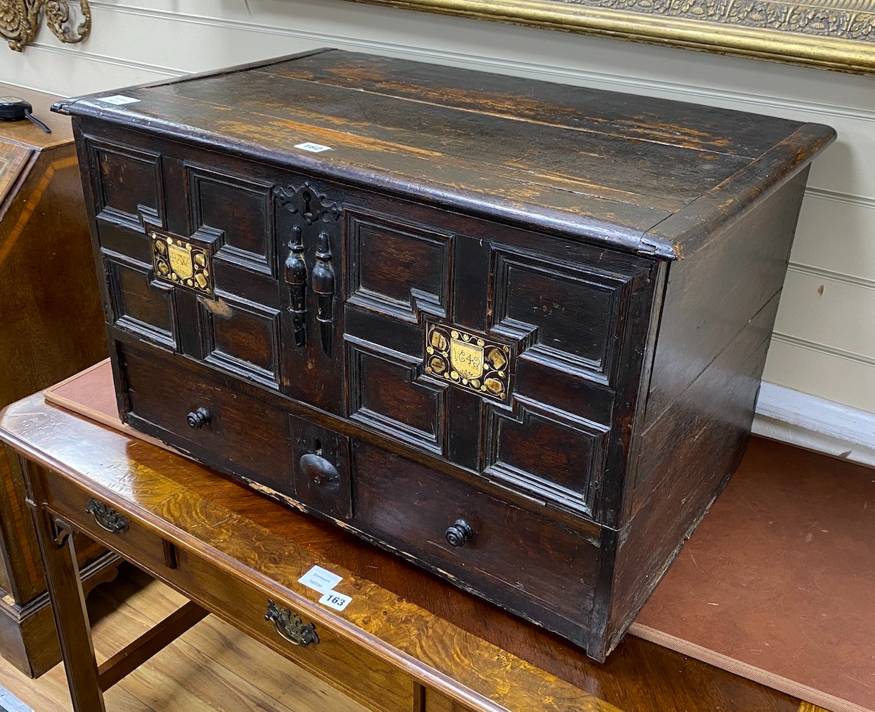 A mid 17th century Continental panelled oak mule chest, with engraved bone inset monograms ‘’R.W’’ and date 1642, width 77cm, depth 47cm, height 48cm